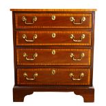 Federal style chest, having a banded inlay top above the four drawer case, rising on bracket feet,