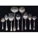 (lot of 9) Associated sterling, coin, and silverplate serving pieces, including a sterling ladle,