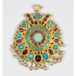 Multi-stone and yellow gold pendant Featuring numerous irregular turquoise cabochons, accented by