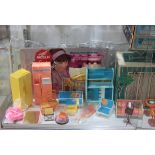 One shelf of vintage Barbie accesories, including refrigerators, Barbie's Friend Ship, Barbie's