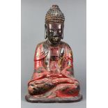Vietnamese gilt red lacquered wood Buddha, with a tall ushnisha above the serene face, in monk's