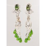 Pair of sapphire, tsavorite, diamond and 14k white gold earrings Featuring (2) oval-cut green