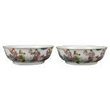 Pair of Chinese porcelain shallow bowls, the exterior depicting immortals with various attributes in