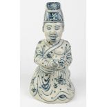 Vietnamese Chudau-style underglazed blue porcelain figure, of an official in genuflection holding