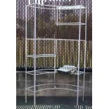 French bistro style painted metal etagere, having a shaped form with glass shelves, 77"h x 47"w