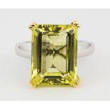 Citrine and 14k gold ring Featuring (1) emerald-cut citrine, weighing approximately 10.25 cts.,