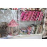 Two shelves of mostly Barbie accesories, such as clothing including Fashion Avenue Collection, Haute