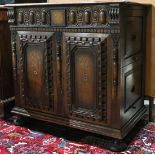 Filing cabinet, the two side drawer case with a carved wood front and rising on compressed bun feet,