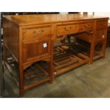 Chinese five-pieced wooden desk, with a large panel top consisting of two floating panels, set above