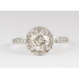 Diamond and 18k white gold ring Centering (1) round brilliant-cut diamond, weighing a total of