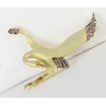 Diamond, enamel and 18k yellow gold bird brooch Designed as a bird in flight, measuring