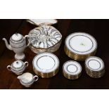 (lot of 63) Wedgwood china table service for twelve in the Colonnade pattern, each having a gilt