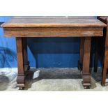 Arts and Crafts quarter sawn oak library table, rising on tressel legs and rising on casters, 30"h x