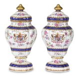 Pair of French Samson covered urns, 19th century, each having a gilt knop surmounting the floral