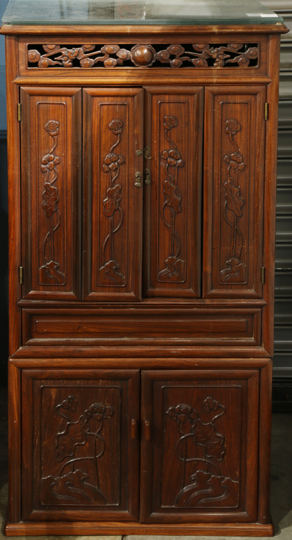 Chinese two-section wooden shrine, the top with a pair of double hinged doors carved with lotus