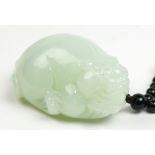 Chinese jade beast form toggle, the recumbent single-horned mythical beast of celadon hue,