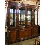 Chinese two-section display cabinet, the top fronted by four hinged glass doors with glass shelves