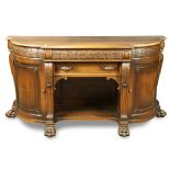 Classical style mahogany sideboard, having a shaped top, above two drawers, and rising on paw