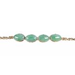 Jadeite and 14k yellow gold bracelet Featuring (4) jadeite cabochons, measuring approximately 17 X