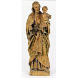 German carved wood figure, of Jesus holding a child, early 20th century, depicted gazing outward and