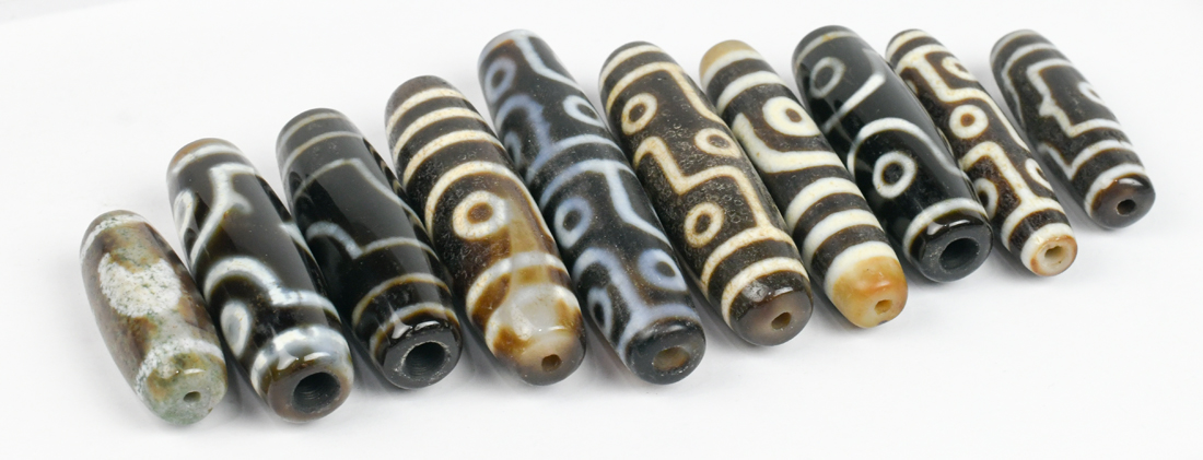 (lot of 10) Tianzhu/Dzi-style beads, mostly of cylindrical form with 'eyes', largest; 2.75"w - Image 2 of 3