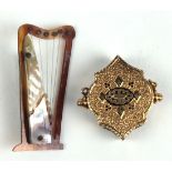 (Lot of 2) Victorian enamel, 14k yellow gold, shell and metal items Including 1) Victorian black