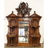 American Renaissance Revival walnut overmantle mirror, circa 1865, possibly California, by John