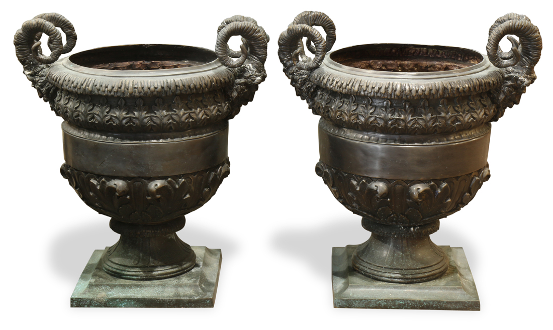 Pair of patinated bronze garden urns, each in the Neoclassical taste, having mythological mounts