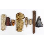 (lot of 8) Eskimo/Inuit hunting implements and fragments, including pendants, pipe, arrowhead,