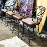 (lot of 4) Moderne metal bar stools, each with scrolling returns, and rising on outswept legs, 41"h