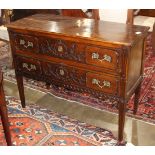 French Louis XVI walnut commode, circa 1860, the two drawer case rising on reeded tapering legs,
