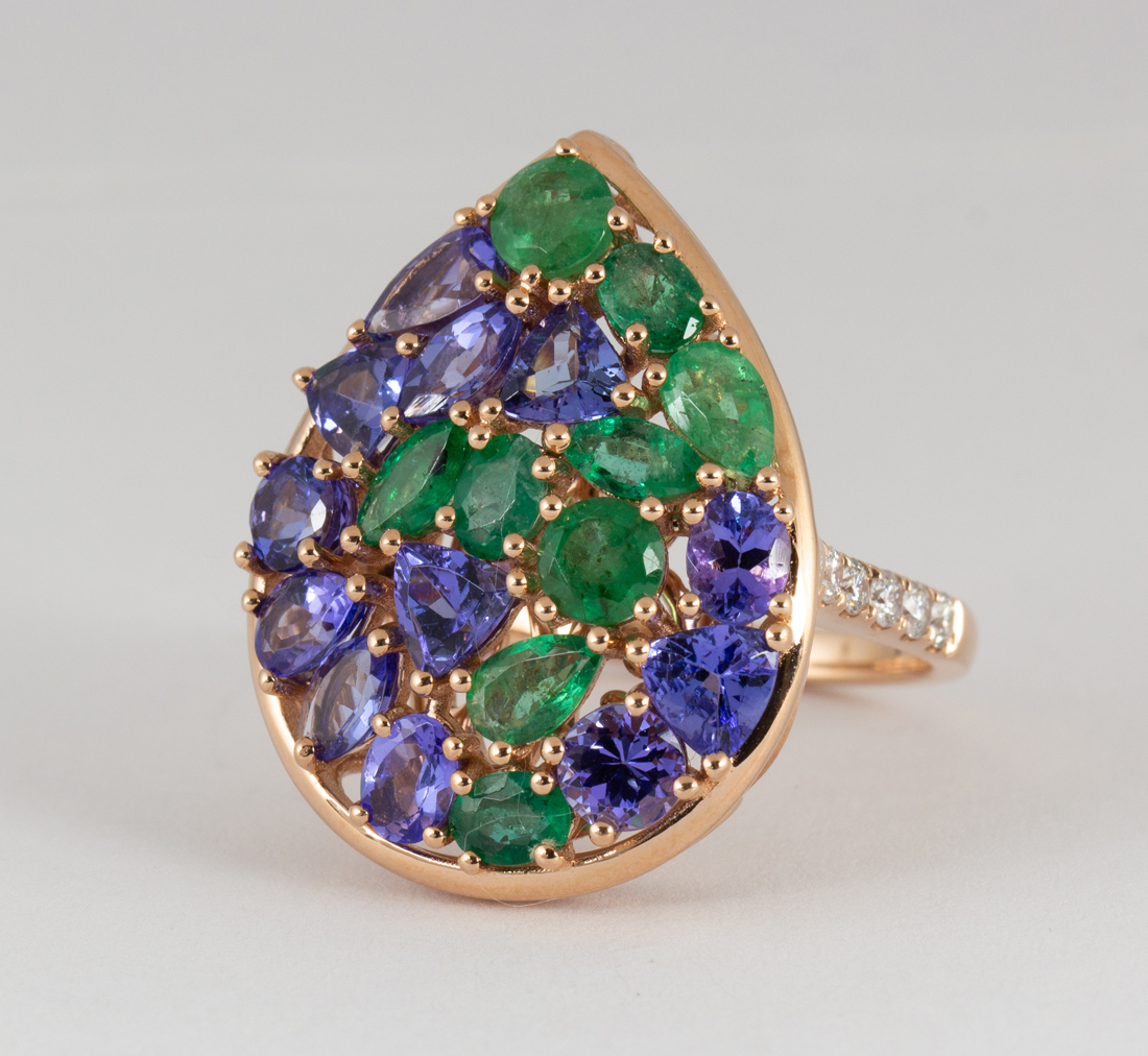 Tanzanite, emerald, diamond and 14k yellow gold ring Featuring (11) varying-shaped emeralds,