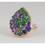 Tanzanite, emerald, diamond and 14k yellow gold ring Featuring (11) varying-shaped emeralds,