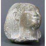 Egyptian stone carved bust of a nobleman, possibly a pharaoh, having an elaborate coiffure and