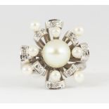 Cultured pearl, diamond and 14k white gold ring Centering (1) cultured pearl, surrounded by (8)