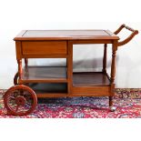 Butler's Chinese rosewood tiered serving cart, having a turned handle flanking the rectangular