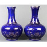 Pair of Chinese gilt cobalt blue porcelain vases, with a trumpet neck above a globular body