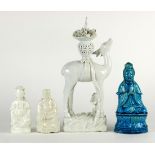 (lot of 4) Chinese blanc de chine porcelain figures: deer with a flower basket; a seated Guanyin;