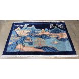 Chinese Art Deco carpet, having a rich blue field with stylized flora and fauna reserves 5'11" x 8'