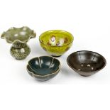 (lot of 4) Chinese ceramics: two dark glazed tea bowls, one of foliate form; a yellow ground bowl