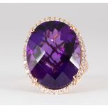 Amethyst, diamond and 14k rose gold ring Centering (1) oval-cut amethyst, weighing approximately