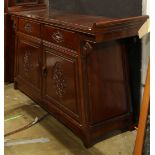 Chinese wooden sideboard, fronted by two drawers and above pair of hinged doors carved with birds