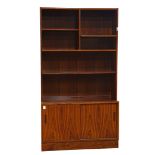 Modern rosewood cabinet, having a rectangular top above the shelved superstructure, continuing to