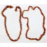 (Lot of 2) Amber bead necklaces Including 1) necklace, composed of irregular polished graduating