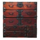 Japanese tansu chest, 19th century, with iron fittings, pole hangers and two handles on either side,