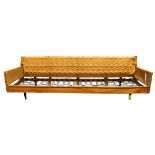 Paul McCobb sofa frame, having a wing back, on a black lacquered maple frame, with intact springs,