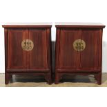Pair of Chinese small lacquered cabinets, each fronted by a pair of hinged doors and with a
