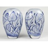 (lot of 2) Kosta Boda art glass vases, each having a tapered form decorated with cased blue flowers,