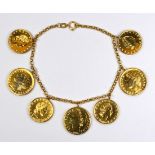 14k yellow gold, plated, coin form bracelet Featuring (7) metal plated Italian 50 and 100 Lira