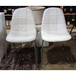 Pair of Eames style side chairs, having a chrome tubular frame supporting the white contoured seat